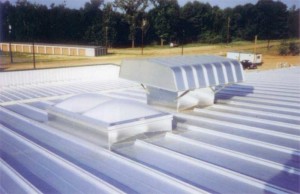 Protecting a steel roof from corrosion goes beyond simply specifying proper coatings. Choosing a preformed equipment curb of all-welded aluminum (with diverters at the uphill side) is better than shop-welded products that leave rust. Photo courtesy Metal Roof Advisory Group