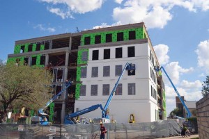 A continuous air barrier is installed in a one-coat application by spraying or power-rolling over concrete masonry units and gypsum board sheathing. The air barrier is vapor permeable to allow diffusion drying. Photo © Corey Ball. Photo courtesy WPL Tyvek