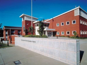 Metropolitan St. Louis Psychiatric Center in Missouri sought exceptionally strong windows, while still offering a symmetrical exterior appearance between secure and nonsecure areas. To meet this challenge, a custom, 152-mm (6-in.) deep system with a hidden ventilator on the exterior and a window on the interior was engineered. The interior security glass was a five-ply, glass-clad polycarbonate glazed into the sash with mechanically fastened, continuous glazing beads. Tamper-proof locks prevent unwanted access to the venetian blinds and ventilators sealed between the panes. For the hospital areas not requiring the high-security windows, a combination of thermal and acoustical high-performance window walls were specified. Photos courtesy Wausau Window and Wall Systems