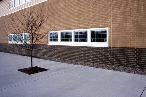 South Canton Scholars School (Canton, Michigan) features utility bricks in dark gray and ‘natural.’ The bricks were one of several features offering benefits of lower cost and sustainability, including stormwater management and computer-managed HVAC. 