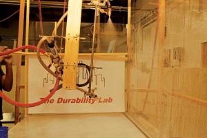 This test setup has a square-pattern nozzle spraying vertically, simulating a steady rain. The amount of water looks low, but it is equivalent to rainfall of 203 mm (8 in.) per hour. The problem is peak intensity rainfall is briefly higher during storms. The lower, angled nozzle is not currently spraying on the threshold.