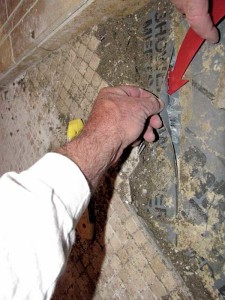 In this photo, the seam in the shower pan waterproof membrane was not installed correctly and allowed water to migrate through.