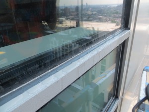 Significant condensation was observed on the exterior surface of the curtain wall during warm humid weather. Photo courtesy Jeffrey N. Sutterlin