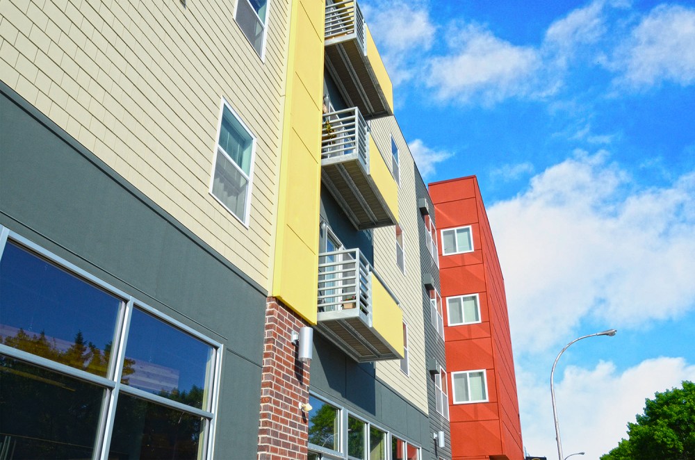 This apartment complex in Grand Forks, North Dakota, employs fiber cement plank, panel, shingle, and trim.