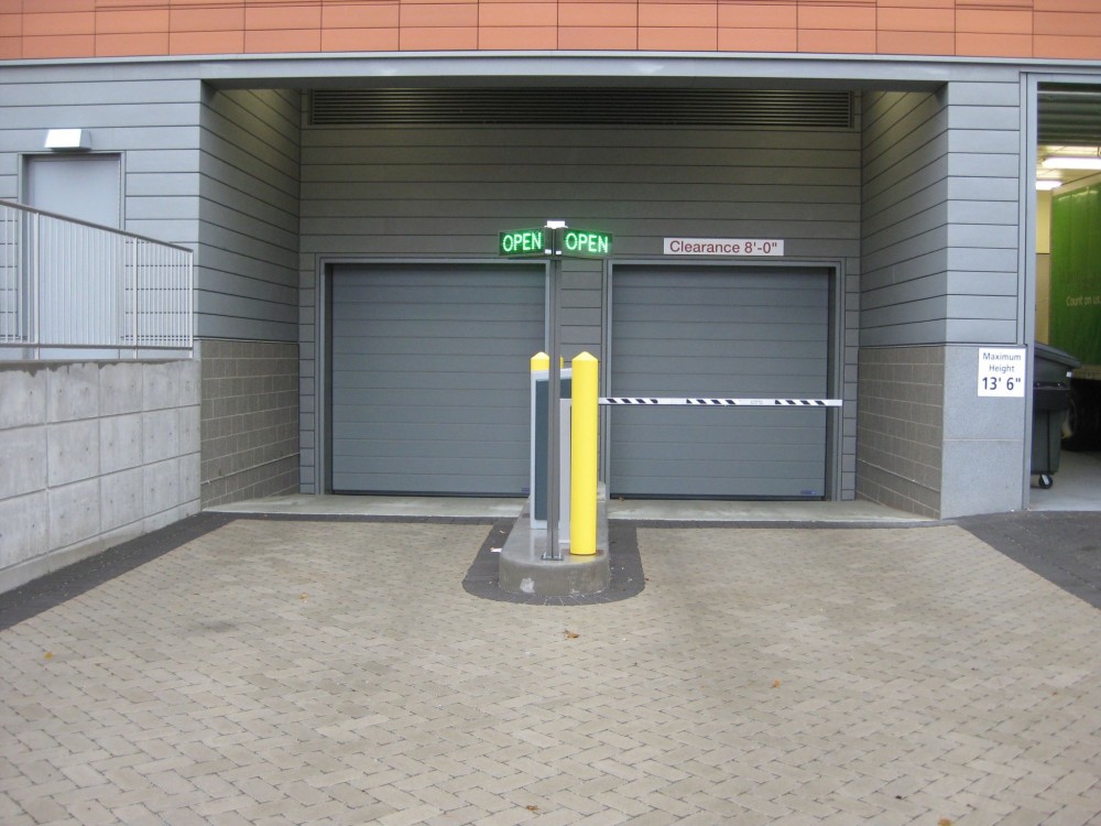 Some parking areas have limited vehicle access openings, so operational dependability of the door is critical.