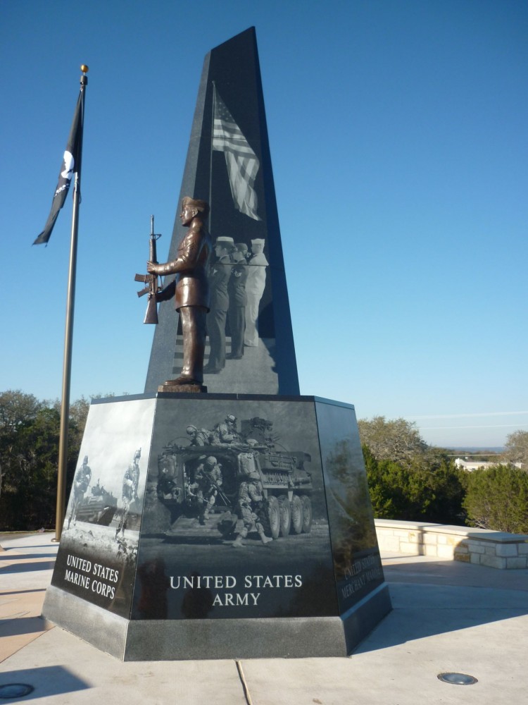 The Cedar Park Veterans Memorial features a black granite obelisk—a 3.6-m (12-ft) diameter, gray granite base of 1.8-m (6-ft) tall panels. 