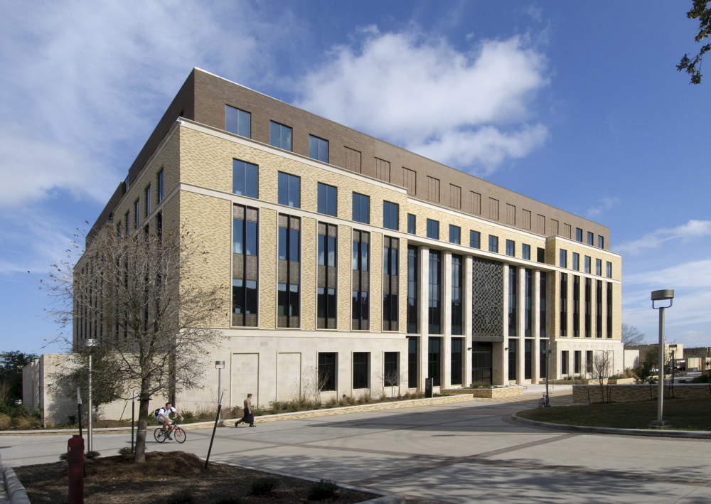 A fl uid-applied air and water barrier system is ideal for this building, which consists of multiple substrates and exterior claddings. The air barrier was installed over CMUs and gypsum board sheathing substrates; the multi-story curtain wall consisted of cut limestone on the fi rst fl oor, brick veneer on the upper fl oors, cast stone trim work, and perforated metal panels.