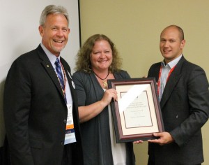 Author Lori Greene, winner of the ‘article-of-the-year’ award, is flanked by CSI’s Casey Robb and magazine editor, Erik Missio.