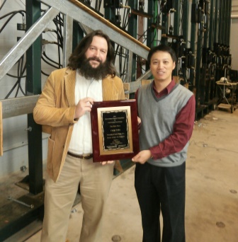 First-place competition winner Chris Willis (left) won first place in a cold-formed steel (CFS) design competition. At right is one of the program’s organizers, the University of North Texas’ Cheng Yu, PhD. Photo courtesy AISI