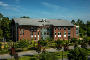 To meet budgetary restrictions, the design team turned to aluminum roof and siding panels.