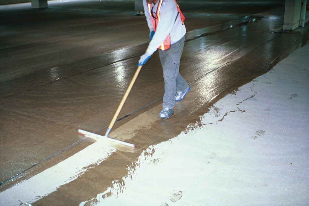 Applying an epoxy healer/sealer to a concrete deck can be a quick, effective, lowmaintenance option.