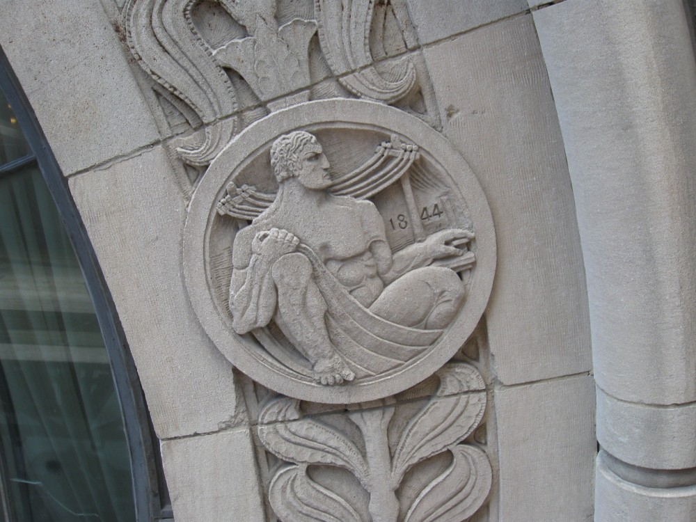 One of the several limestone medallions at the entrance – each medallion has a unique carving.