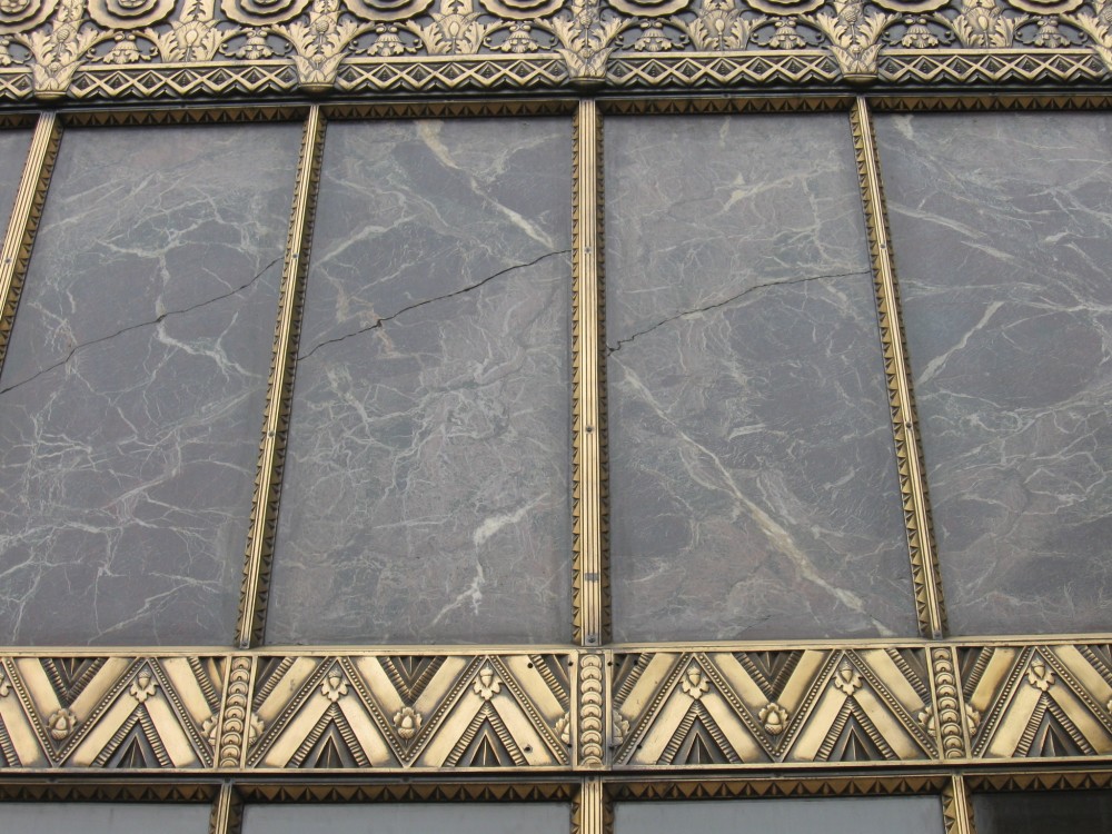 This existing marble at the main entrance was replaced in the ornamental brass framing.