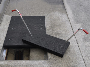 As the industry experiences high numbers of hazards and injuries when using traditional steel and other metal products for conventional access covers, it is turning to safer alternatives, such as composite materials. Photo courtesy Fibrelite