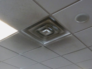 Soot from jet fuel exhaust can darken ceilings in airport terminals. Hygienic panels would simplify cleaning. Photo courtesy Michael Chusid