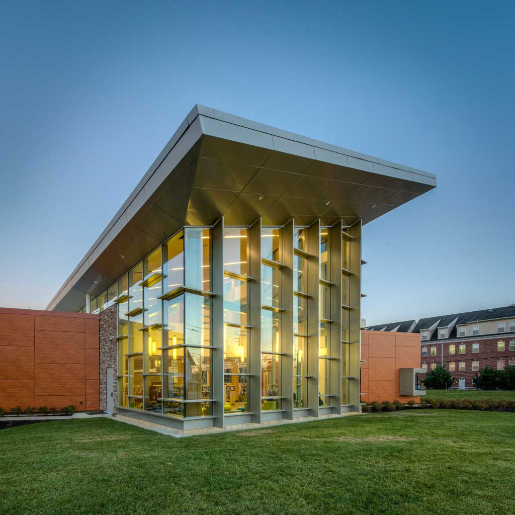 The library has a high canopy above the large glass entryway.