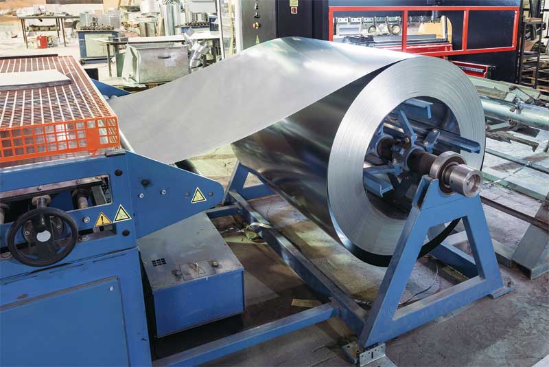 Coil of galvanized steel sheet for manufacturing metal heating and ventilation pipes. Photos © BigStockPhoto.com