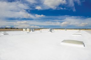 Silicone coating can extend the life expectancy of flat commercial roofs, delaying the need for costly and time-consuming maintenance or replacement. Photo courtesy Icynene-Lapolla