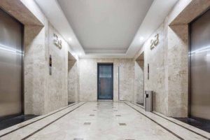 The use of elevator lobbies as smoke enclosures has long been a required form of protection from smoke migration through hoistway shafts. Listed swing doors typically seal the space, minimizing infiltration.