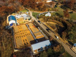 Construction photo showing engineered wood fiber (EWF) surrounding the teaching garden beds at the New York Botanical Garden’s (NYBG’s) Edible Academy. EWF was specified to meet accessibility requirements and serve visitors of all abilities in the gardens, while also allowing for permeable surfacing required for site drainage and stormwater management. Photos courtesy the New York Botanical Garden