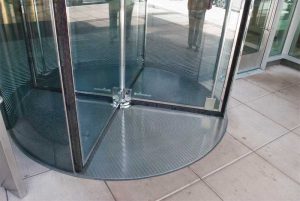 An embed frame is necessary to act as a transition between flooring types and also hold and support all-glass sidewalls.