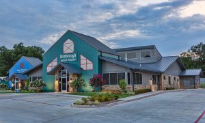 The new Kimbrough Animal Hospital in Longview, Texas, was reborn with a rural appeal and colorful exterior using metal panels. Photo courtesy Buenavistaphotography.com