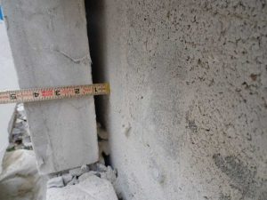 Veneer wall system with cast stone cladding, 25-mm (1-in.) air space, and concrete masonry unit (CMU) backup. Note the absence of a water-resistant barrier (WRB).