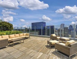 Laminated glass and an aluminum or steel framing system provide a sturdy, transparent shield for any outdoor rooftop amenity in mixed-used, healthcare, and hospitality design plans.