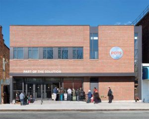 Spacesmith’s design for Part of the Solution (POTS) office in Bronx, New York, includes a full-service kitchen and dining area, food pantry, counselling offices, a clothing exchange, showers, a barber shop, and medical suites.