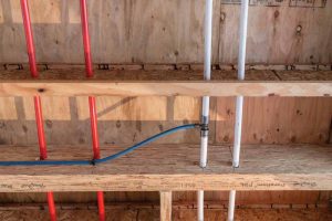 PEX plumbing installation in a multifamily project.