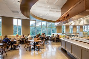 The new dining commons at Mount Holyoke College in South Hadley, Massachusetts, combines three styles of thermoformed ceiling panels as well as a type of mineral fiber panel to create visual scale and flow through the large hall. Photo © Chun Y Lai Photography