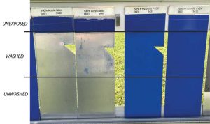 Figure 5: Photo of a cobalt blue natural weathering study taken on August 12, 2018, after weathering in south Florida for more than 17 years. From left to right, the first two panels are 100 percent acrylic latex, approved by Master Painters Institute (MPI) 311, Latex, Exterior, High Performance Architectural, Semi-Gloss, and now eroded and no longer on the test panel, followed by 50 percent PVDF-acrylic (American Architectural Manufacturers Association [AAMA] 2604, Voluntary Specification, Performance Requirements and Test Procedures for High Performance Organic Coatings on Aluminum Extrusions and Panels [with Coil Coating Appendix]), and 70 percent PVDF (AAMA 2605, Voluntary Specification, Performance Requirements and Test Procedures for Superior Performing Organic Coatings on Aluminum Extrusions and Panels [with Coil Coating Appendix]).