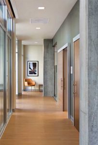 Interior sliding doors impact less space through door operations, improving wayfinding and usability in tight or enclosed areas.