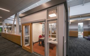 The North Creek High School, Bothell, Washington, used single leaf sliding doors to support the collaborative culture at the school, provide space savings, daylighting, and sound attenuation. Photo © Chris Eden/edenphotography.us. Photo courtesy AD Systems