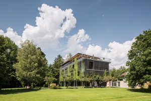 Snøhetta completes a lush and open timber office for ASI Reisen in Natters, Austria. Photo © Christian Flatscher