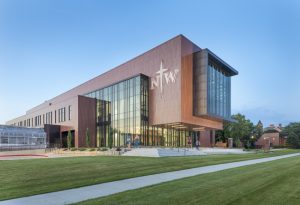 The DeWitt Family Science Center, Orange City, Iowa, used coated metal for its exterior to match the brick buildings on the Northwestern College campus and add a modern touch. Photo courtesy Sherwin-Williams