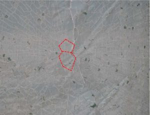 Nickel sulfide (NiS) inclusion failure is characterized by a breakage pattern resembling a butterfly, figure-8, or back-to-back D (outlined in red). However, other types of inclusions, and even impact, can occasionally create similar patterns, so until the glass is analyzed, NiS inclusion should not be assumed.  Photo courtesy Hoffmann Architects, Inc.