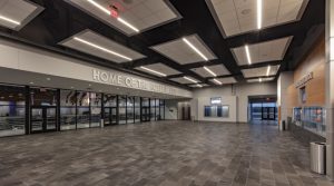 The Noble Public School, Oklahoma, used aluminum ceiling panels on its fine arts auditorium and gymnasium to meet the design, budget, and acoustical goals of the multipurpose space. Photo © Simon Hurst Photography. Photo courtesy of Rockfon