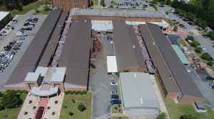 Symmetrical standing seam metal panels solve roofing problems for the Central Georgia Technical College campus in Warner Robins, Georgia. Photo courtesy McElroy Metal