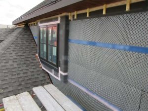 A rainscreen comprises the material, the type of channel and clip arrangement that are employed to fasten the veneer, the dimension of the air gap, the flashings and air- and water-resistive barrier.