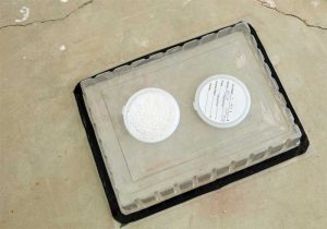 For the Calcium Chloride Test, a calcium chloride disk is first weighed, then placed under a sealed plastic sheet and left to collect moisture vapor. The disk is again weighed after 24 hours. The difference in weight indicates the amount of moisture vapor that emerged from the slab.