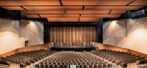 Gallatin High School, Bozeman, Montana, enhances viewing experience of various events in their auditorium by integrating a custom-designed acoustical shell system. Photo courtesy Staging Concepts