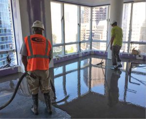 Figure 7: Maintaining a wet edge between successive self-leveling cementitious underlayment (SLU) pours and gauge raking before exceeding the products’ working time, ensure a smooth surface for all types of flooring.