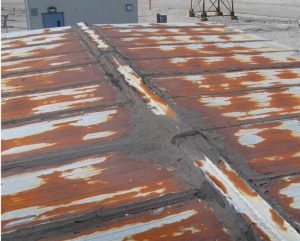 Deteriorated metal panels and joints.