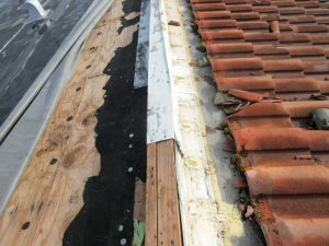 One of the most noticeable signs of hurricane roof damage are lost or damaged tiles.