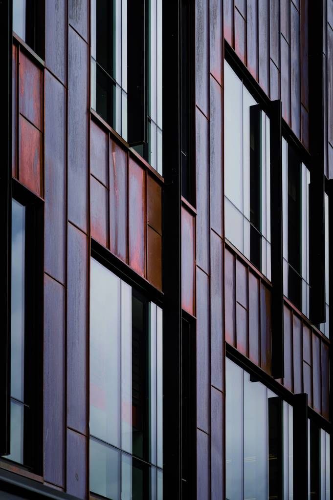 Closeup of the copper panels on the facade of the college’s center.