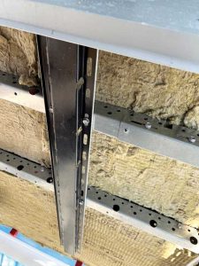 For overcladding structural masonry in cold climates, a rainscreen system provides the best opportunity for including continuous insulation (ci).