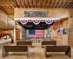 Another interior view of Opry House and Saloon, with a view of the stage.