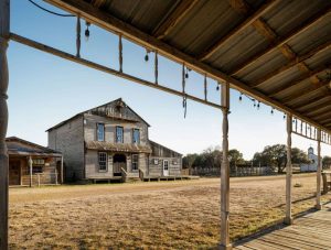 The Luck Ranch’s Opry House seen from the covered walkway of another structure on Willie Nelson’s movie set in Spicewood, Texas.