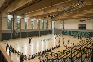 The mass timber structure is evident in the walls and throughout the ceiling.